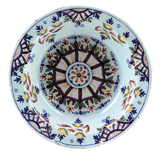 A LONDON DELFT DEEP DISH OF 'ANN GOMME' TYPE