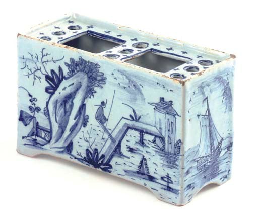 AN ENGLISH DELFT BLUE AND WHITE FLOWER BRICK