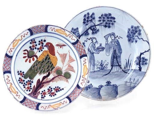 AN ENGLISH DELFT BLUE AND WHITE LARGE PLATE AND A DUTCH DELFT POLYCHROME PLATE
