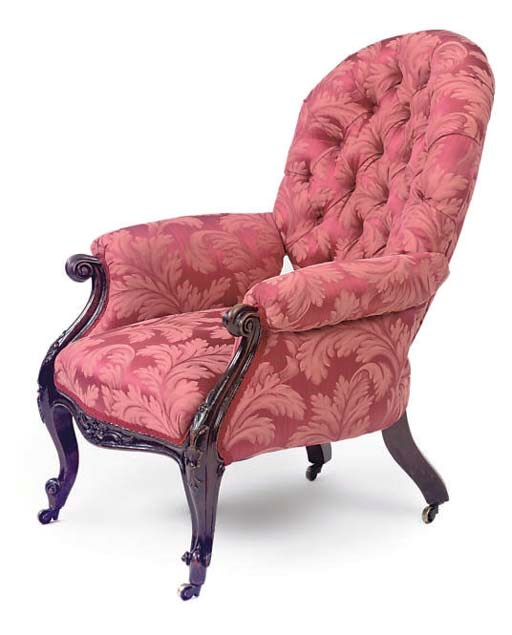 A VICTORIAN WALNUT EASY ARMCHAIR