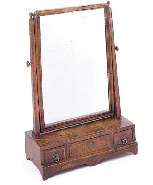 A WALNUT AND FEATHERBANDED DRESSING MIRROR