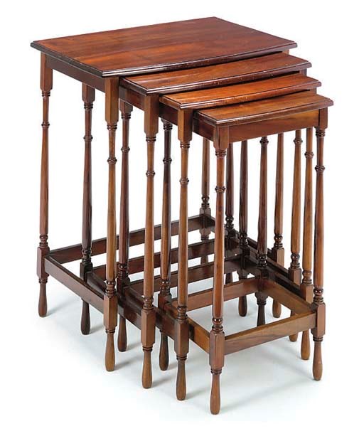 A SET OF MAHOGANY QUARTETTO TABLES