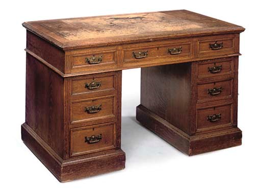 A LATE VICTORIAN OAK PEDESTAL DESK