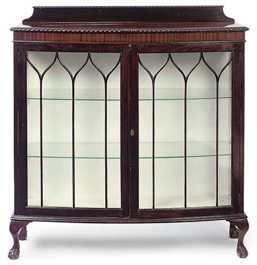 A MAHOGANY BOW FRONT DISPLAY CABINET