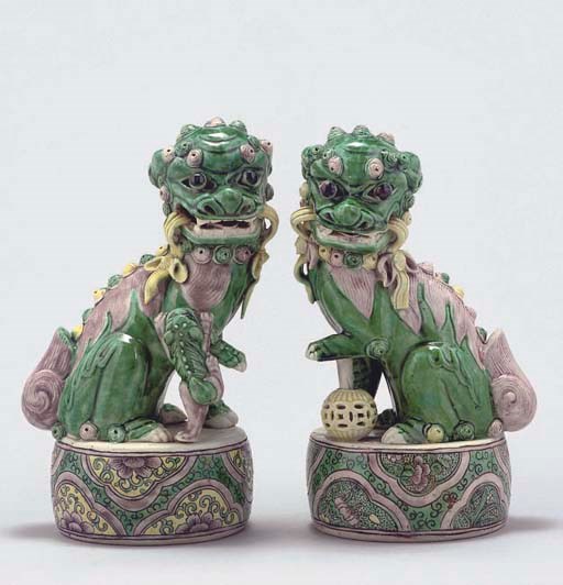 Two similar famille verte Buddhistic lions, 19th Century