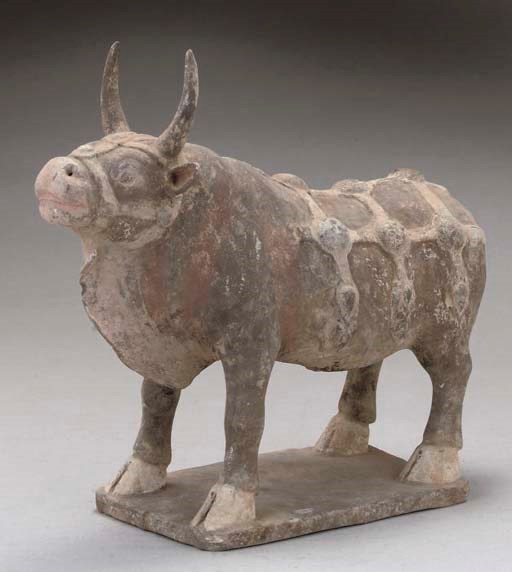 A CHINESE PAINTED POTTERY OX, NORTHERN QI