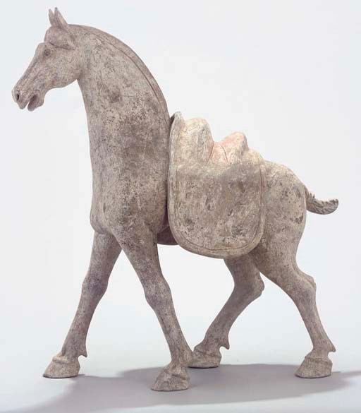 A Chinese pottery model of a saddled horse, Tang dynasty