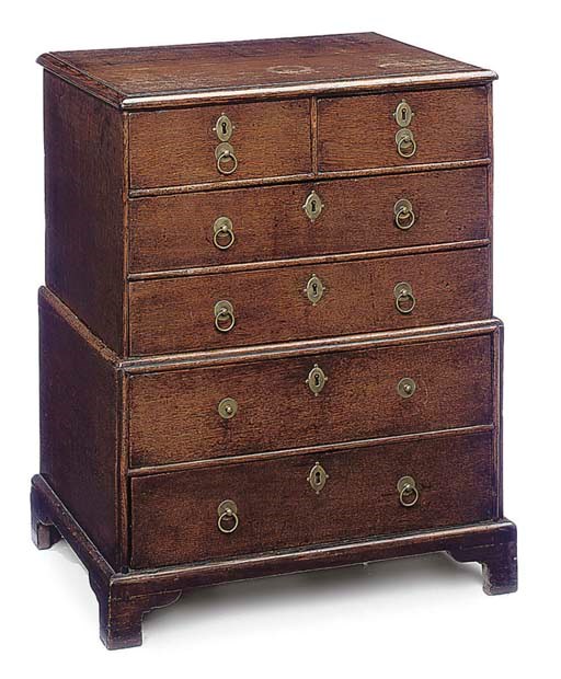 A SMALL OAK CHEST