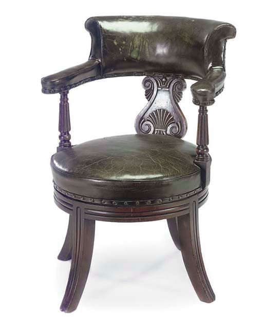A MAHOGANY AND GREEN LEATHER UPHOLSTERED REVOLVING DESK CHAIR