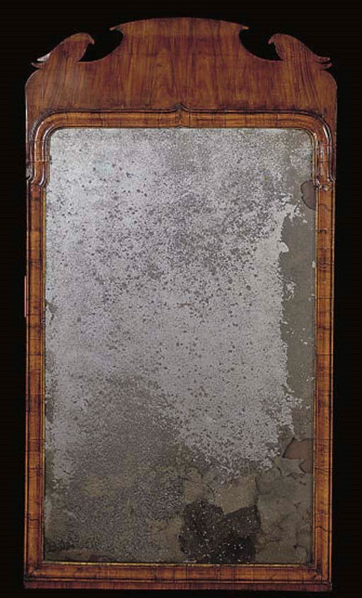 A WALNUT FRAMED MIRROR