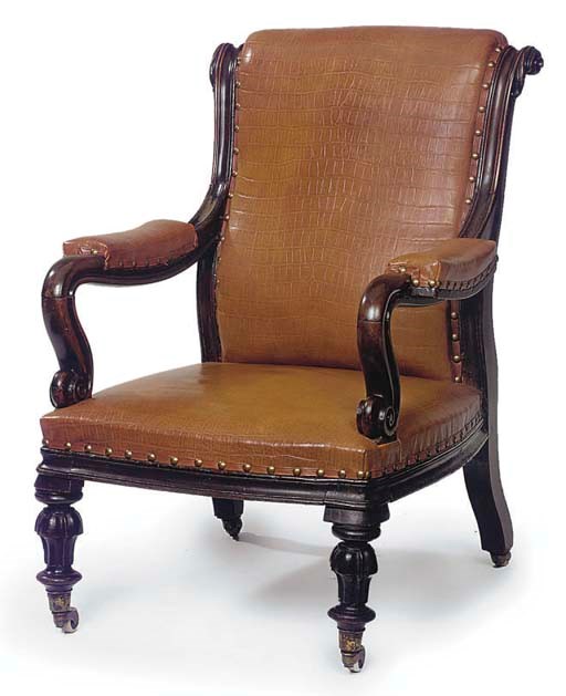 A MID-VICTORIAN MAHOGANY AND TAN-LEATHER UPHOLSTERED ARMCHAIR