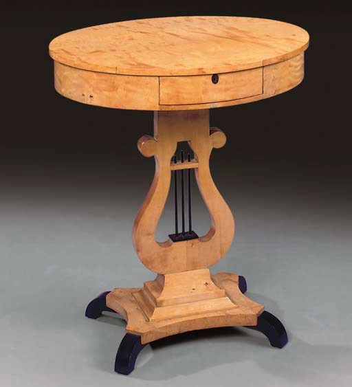 A BIEDERMEIER, BIRCH AND EBONISED OVAL OCCASIONAL TABLE