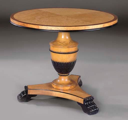 A BIRCH, MAHOGANY AND EBONISED CIRCULAR CENTRE TABLE
