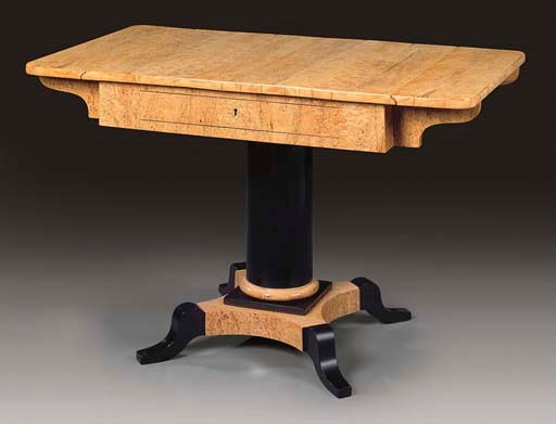 A MASUR BIRCH AND EBONISED SOFA TABLE