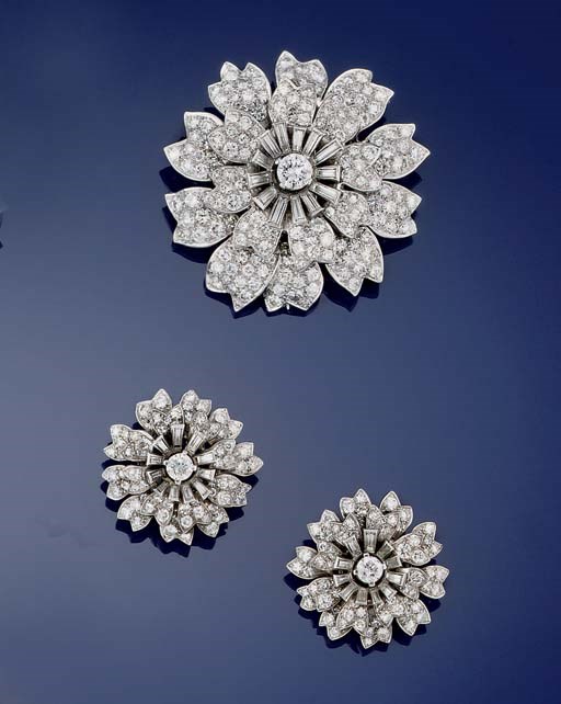 A diamond flowerhead cluster brooch and matching earclips
