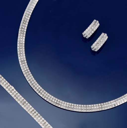 A diamond necklace, bracelet and earclips