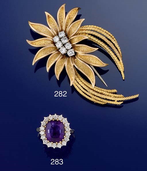 AN AMETHSYT AND DIAMOND CLUSTER RING