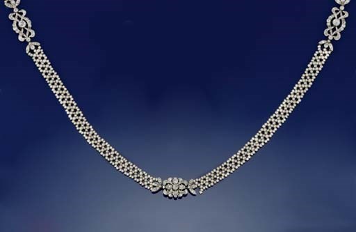 AN EDWARDIAN SEED PEARL AND DIAMOND SAUTOIR