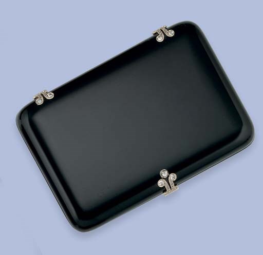 AN EARLY 20TH CENTURY FRENCH ONYX AND DIAMOND CIGARETTE CASE