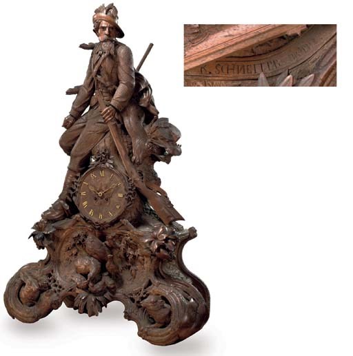 A SWISS 'BLACK FOREST' CARVED WALNUT STRIKING MANTEL CLOCK 'JAEGERUHR'