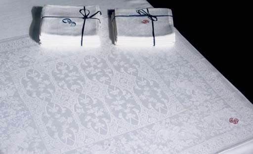 A SET OF TWELVE DAMASK LINEN NAPKINS