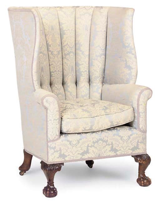 A WALNUT TUB SHAPED ARMCHAIR