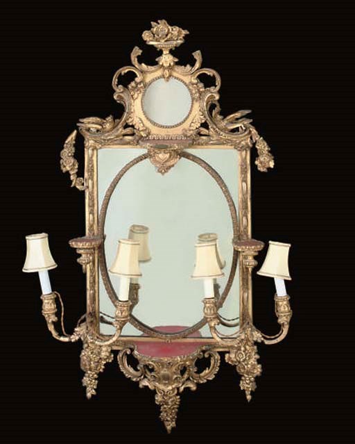 A LATE VICTORIAN GILT COMPOSITION GIRANDOLE MIRROR