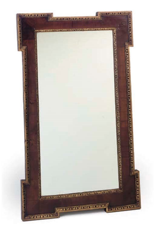 A MAHOGANY AND PARCEL GILT MIRROR