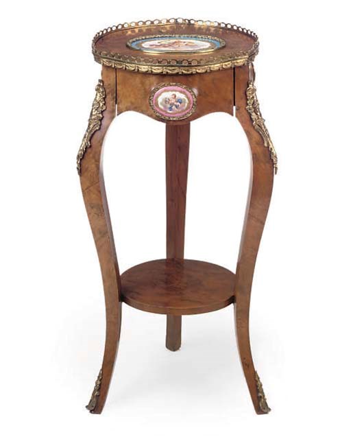 A GILT METAL MOUNTED WALNUT AND PORCELAIN MOUNTED TABLE EN CHIFFONIER