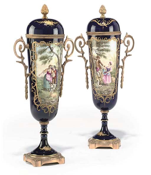 A PAIR OF GILT-BRONZE MOUNTED PARIS PORCELAIN ORNAMENTAL URNS