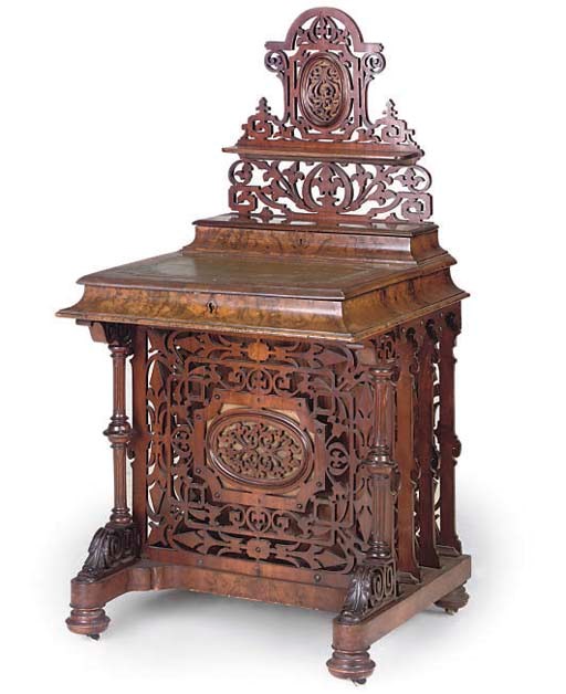 A MID VICTORIAN WALNUT DAVENPORT/CANTERBURY