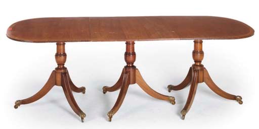 A MAHOGANY THREE PILLAR DINING TABLE