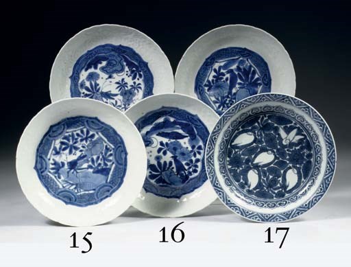 A pair of late Ming blue and white moulded saucer dishes