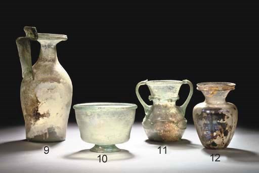 A ROMAN GREEN GLASS JUG