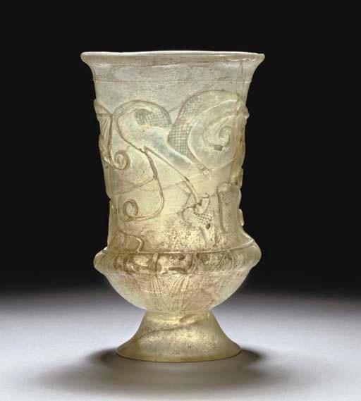 A ROMAN GREEN GLASS SNAKE-THREAD GOBLET