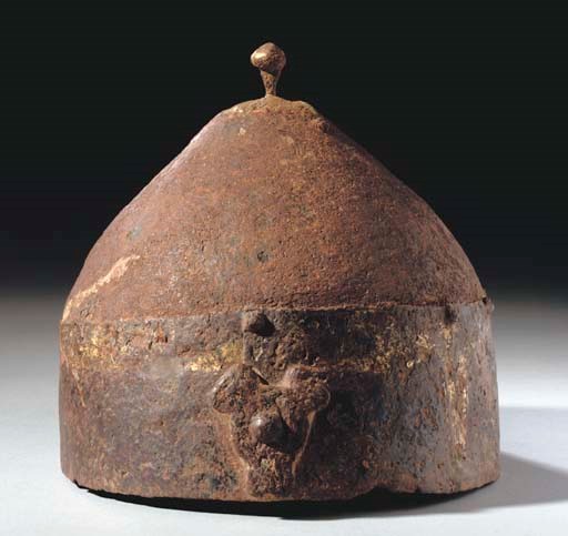 A GOLD WASHED STEEL HELMET