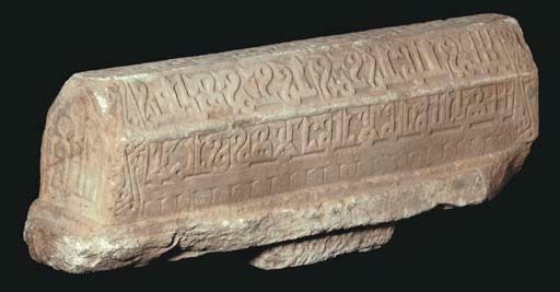 A CARVED WHITE MARBLE PRISMATIC TOMBSTONE