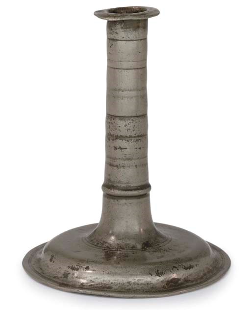AN UNUSUAL ENGLISH PEWTER TRUMPET-BASE CANDLESTICK