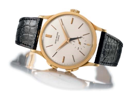 Patek Philippe. A fine and rare large 18K gold dual time zone wristwatch with additional independently adjustable jumping hour hand