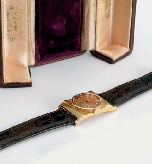 Vacheron Constantin. A fine and unusual 14K pink gold asymmetrical wristwatch with pink dial and box
