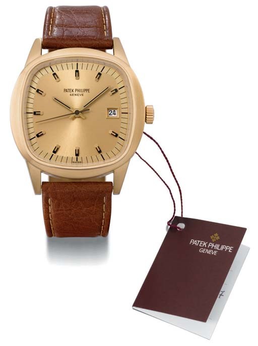 Patek Philippe. An oversized 18K gold cushion-shaped electronic wristwatch with sweep centre seconds and date