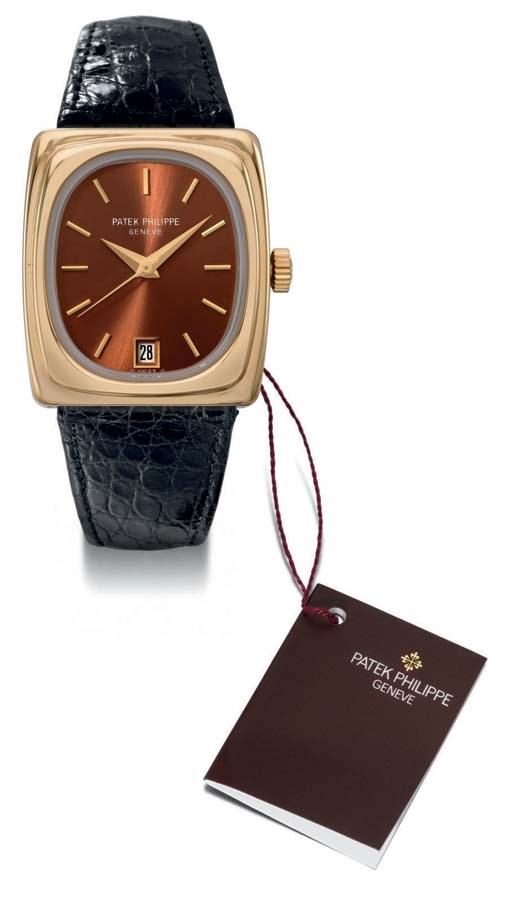 Patek Philippe. A rare 18K gold rectangular electronic wristwatch with sweep centre seconds, date and hidden lugs