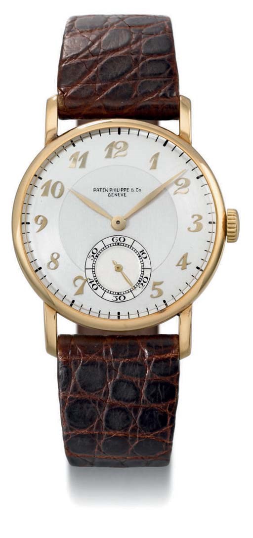 Patek Philippe. A fine, rare and very attractive 18K gold wristwatch with two-tone silvered and champagne dial and Breguet numerals