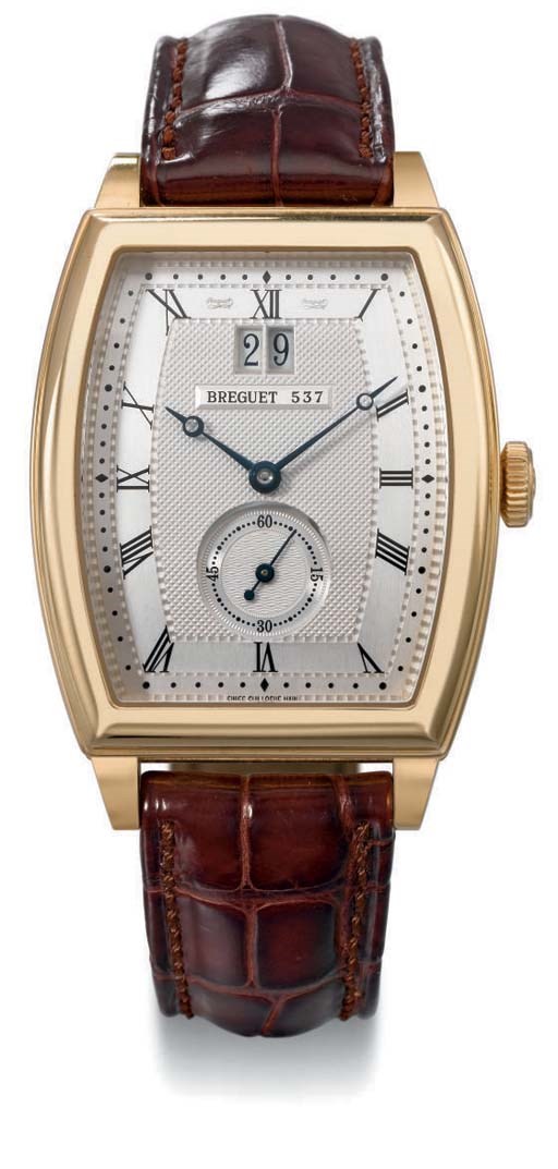 Breguet. A fine and large 18K gold tonneau-shaped self-winding wristwatch with date