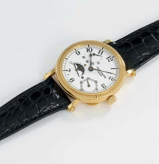 Patek Philippe. A fine 18K gold self-winding wristwatch with up and down indicator and phases of the moon