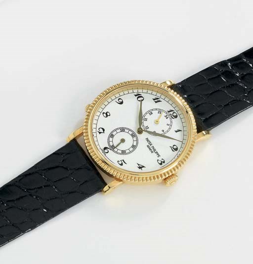 Patek Philippe. An 18K gold two time zone wristwatch
