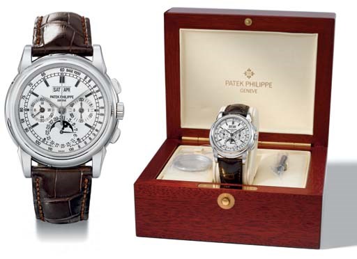 Patek Philippe. A very fine and rare 18K white gold perpetual calendar chronograph wristwatch with phases of the moon