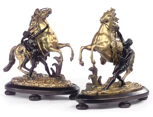 A PAIR OF GILT AND PATINATED BRONZE MODELS OF THE MARLY HORSES