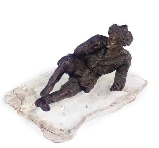 A RUSSIAN BRONZE MODEL OF A COSSACK