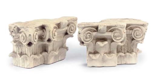 A PAIR OF FRAGMENTARY CARVED LIMESTONE CAPITALS